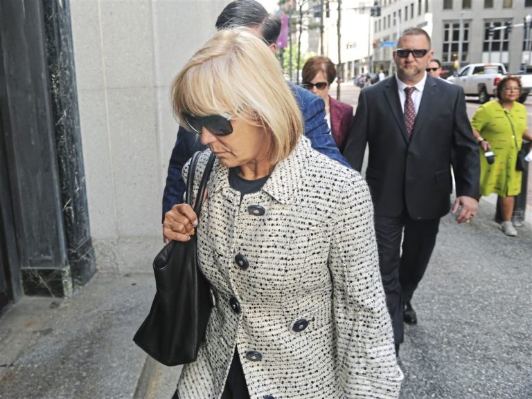 Cynthia Mills enters the Federal Courthouse on Thursday in Downtown Pittsburgh. She is being sentenced for stealing nearly $13 million from Matthews International.   (Nate Guidry/Post-Gazette)