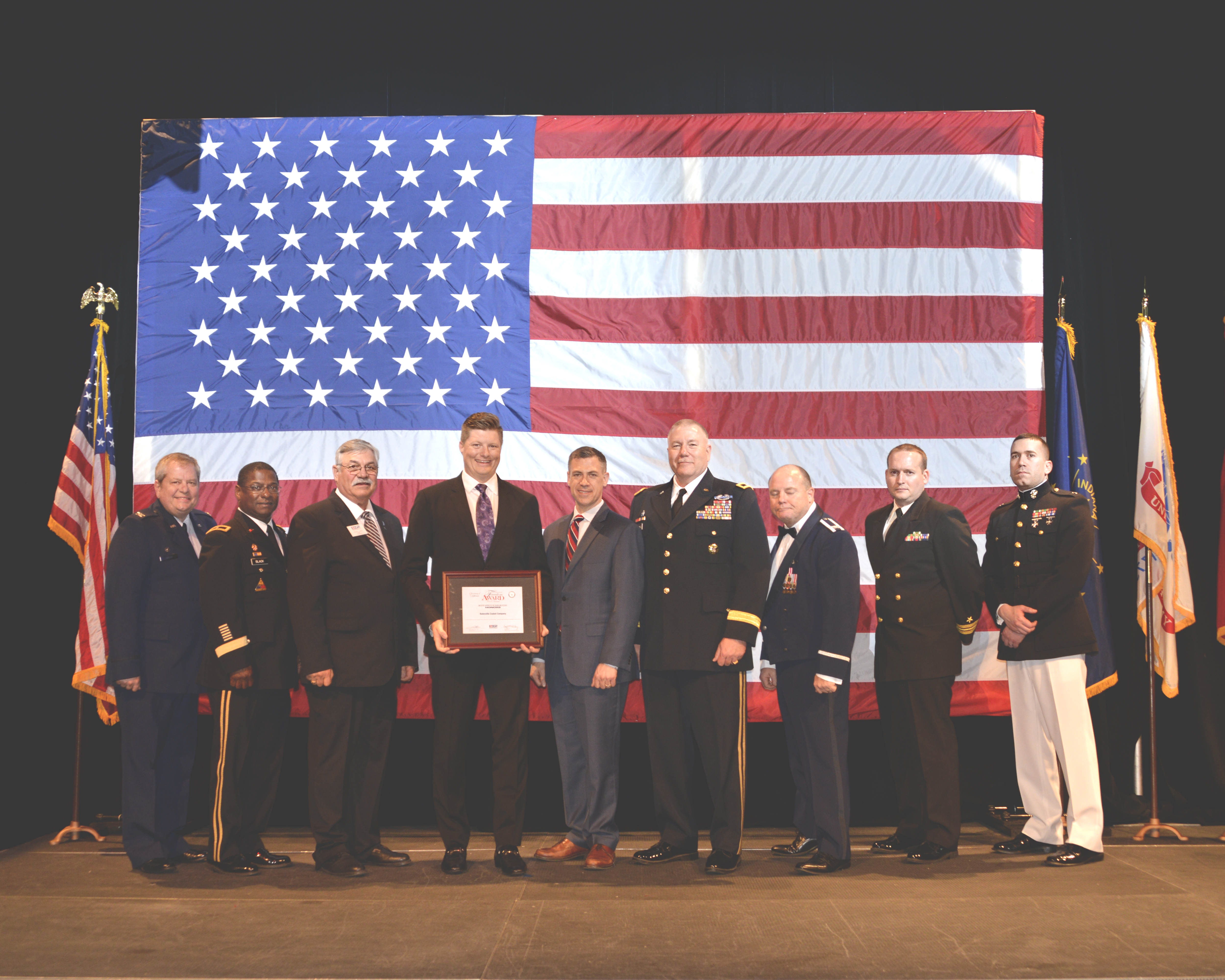 David Meyers is shown with Congressman Jim Banks (IN-03) and military leaders representing various branches of service at the Employer Awards Banquet in Indianapolis.