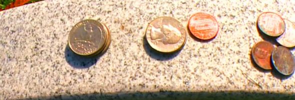 Coins on a gravestone