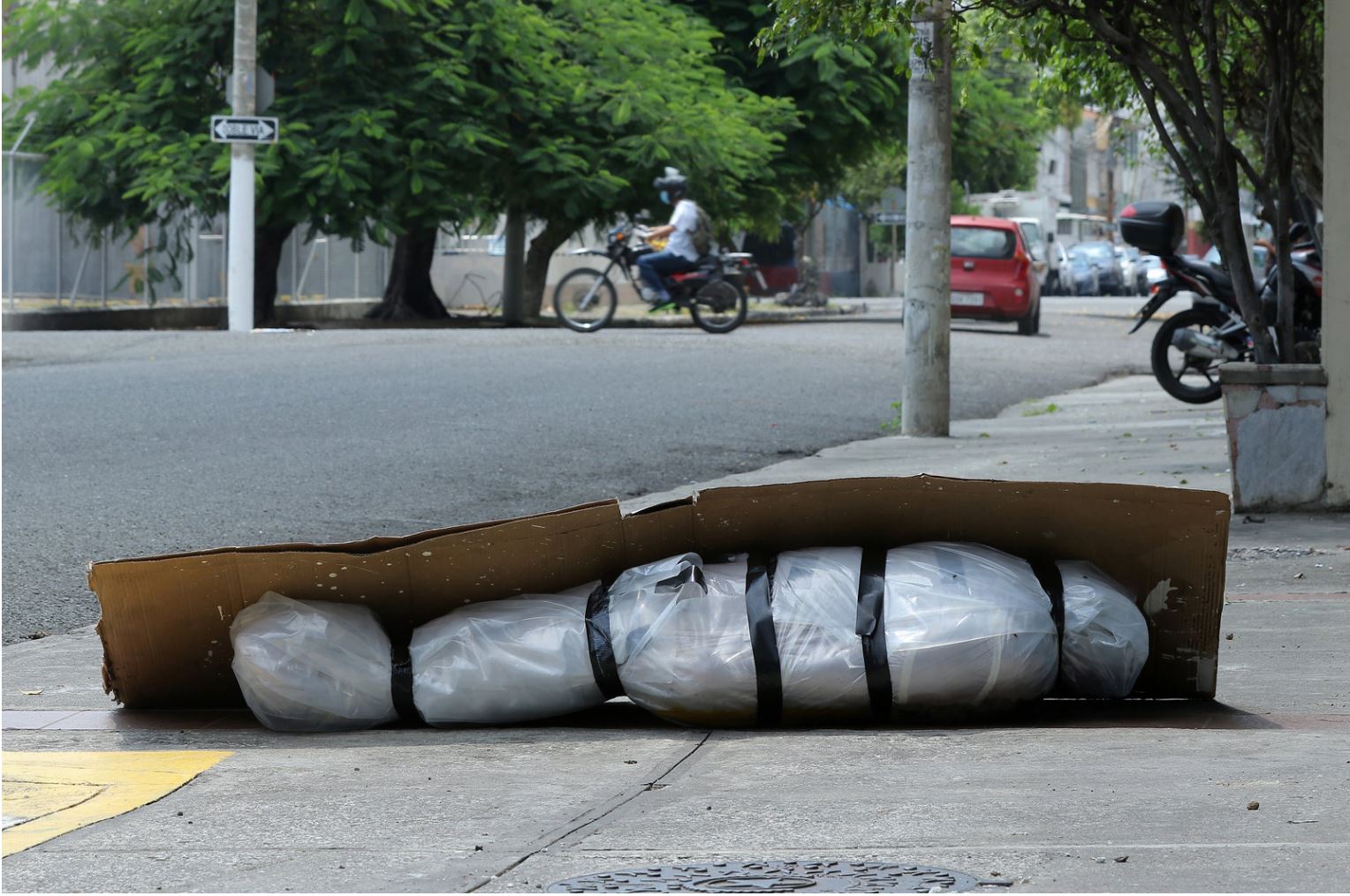 Body on the sidewalk in Ecuador